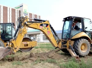 Randy Hope operating an excavator at the 2018 Cascades Casino Chatham groundbreaking